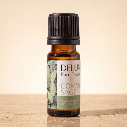 Delune Common Sage Pure Essential Oil, 10ml amber glass bottle on warm travertine stone