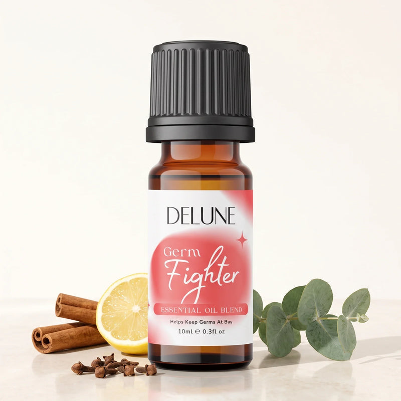 Delune Germ Fighter Essential Oil Blend 10ml amber glass bottle with cinnamon sticks, lemon, cloves and eucalyptus