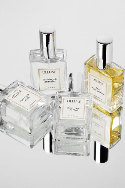 Delune eau de parfum collection: clear glass bottles with silver caps grouped together