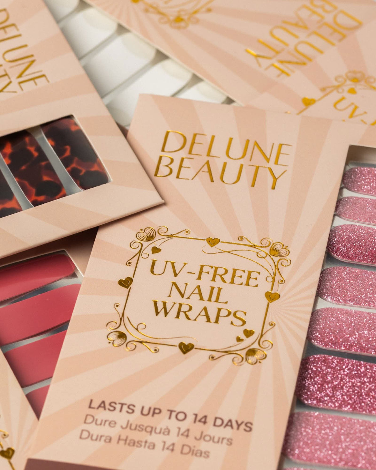 Tortoiseshell Noir (Non-UV Nail Wraps): Delune Beauty UV-free nail wrap packaging, lasts up to 14 days, with tortoiseshell, red and pink glitter wraps