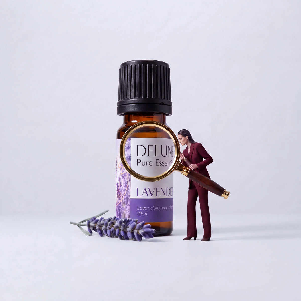 Ethics: a woman inspects a giant Delune Lavender Pure Essential Oil through a magnifying glass